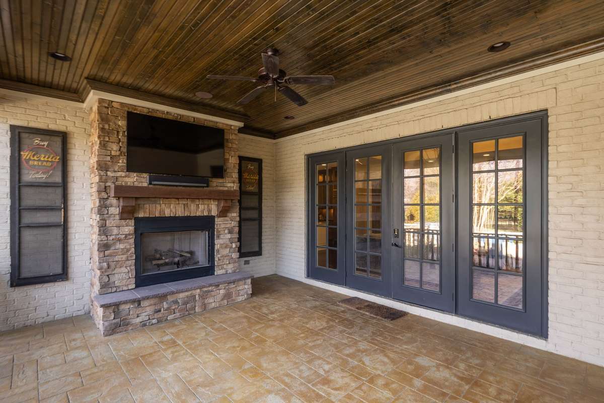 No detail overlooked on this screened in porch!