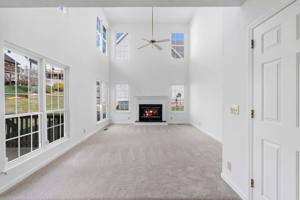 Notice the two-story windows that makes this bright and cheerful!
