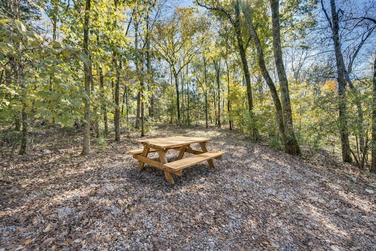 To the left of the driveway as you drive in, one of a few spots to enjoy a meal and nature.