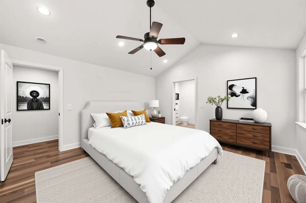 The  master bedroom can handle all your furniture needs and more.