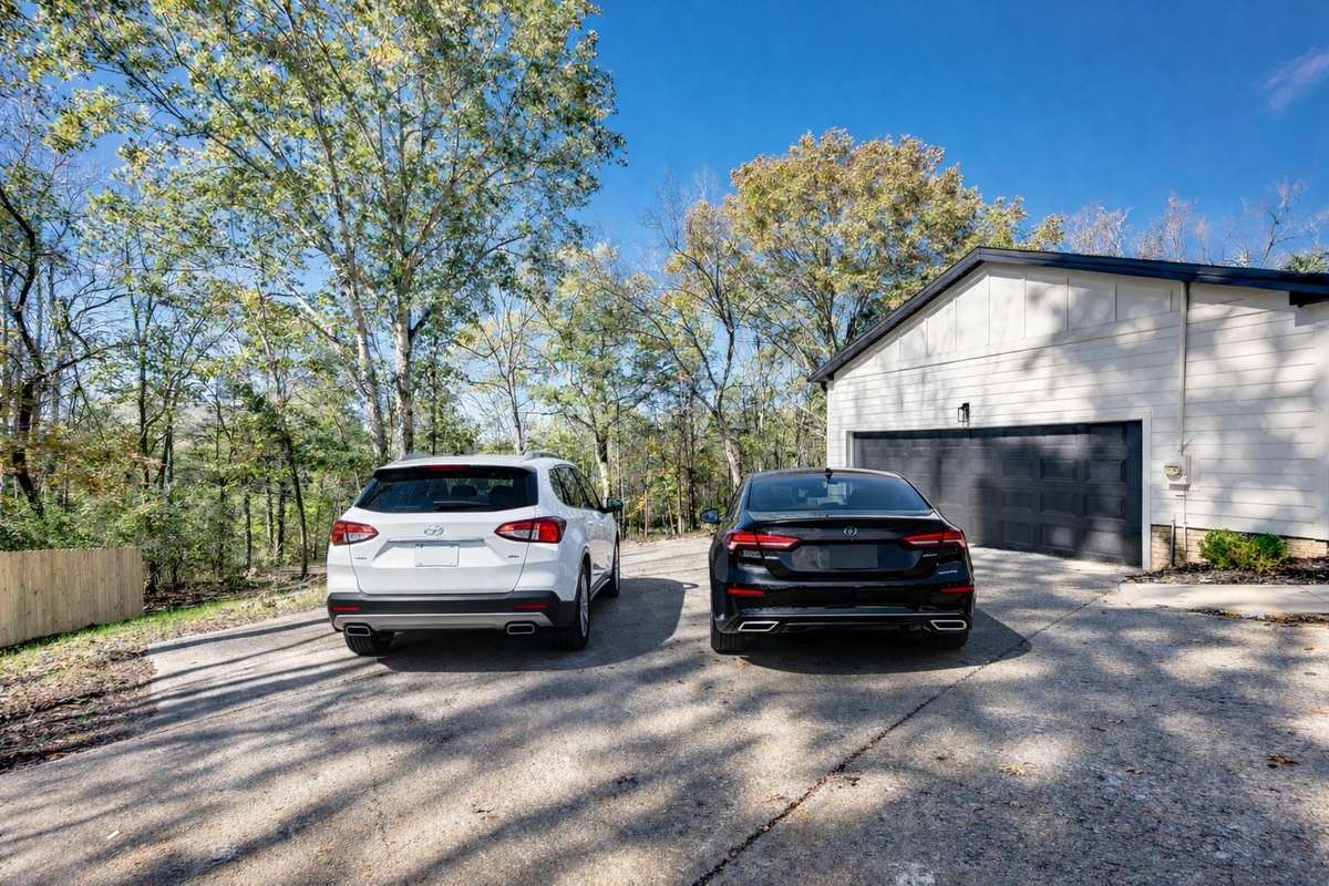 This driveway can handle two cars, a trailer or a boat.