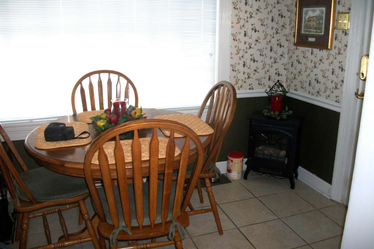 Another view of Breakfast Room off from Kitchen.  There is a door that goes outside to covered deck and beautiful backyard