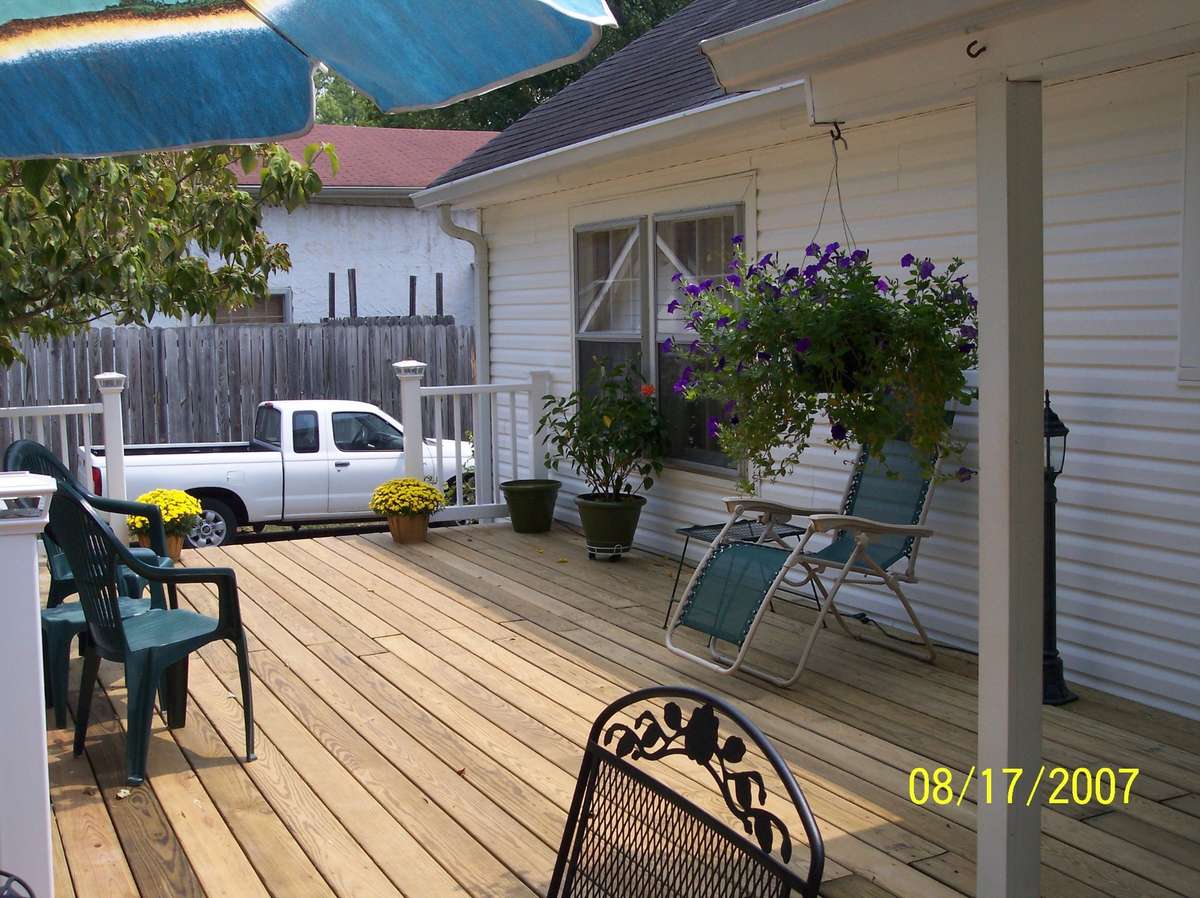 Another view of back deck and area that goes into driveway