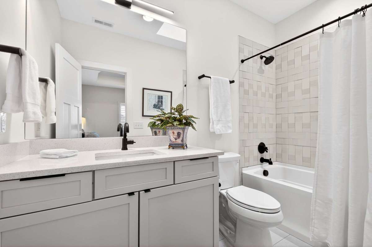The third bedroom includes a full en suite bathroom.