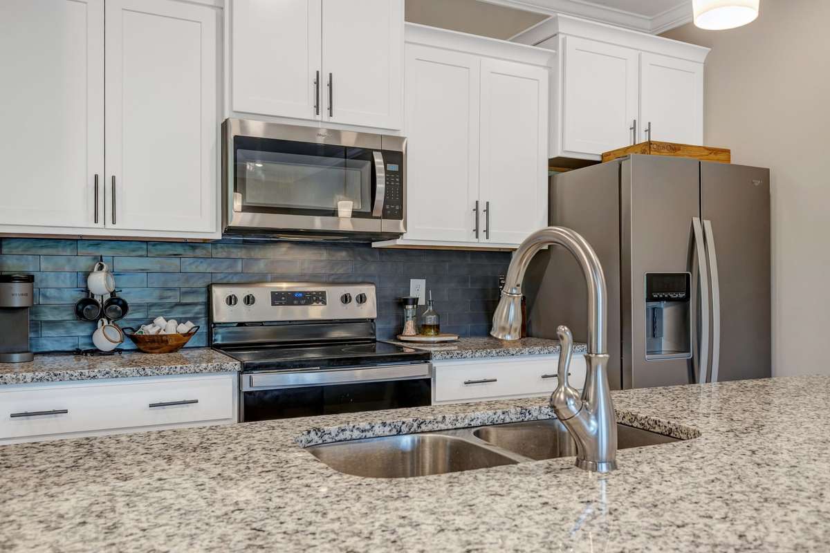 All appliances in kitchen remain! Fridge included.