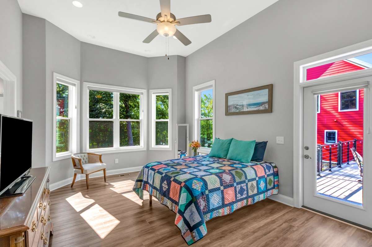 Exit onto the patio from the primary bedroom.