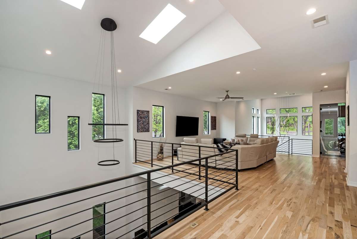 The home’s contemporary design continues seamlessly throughout the upper level