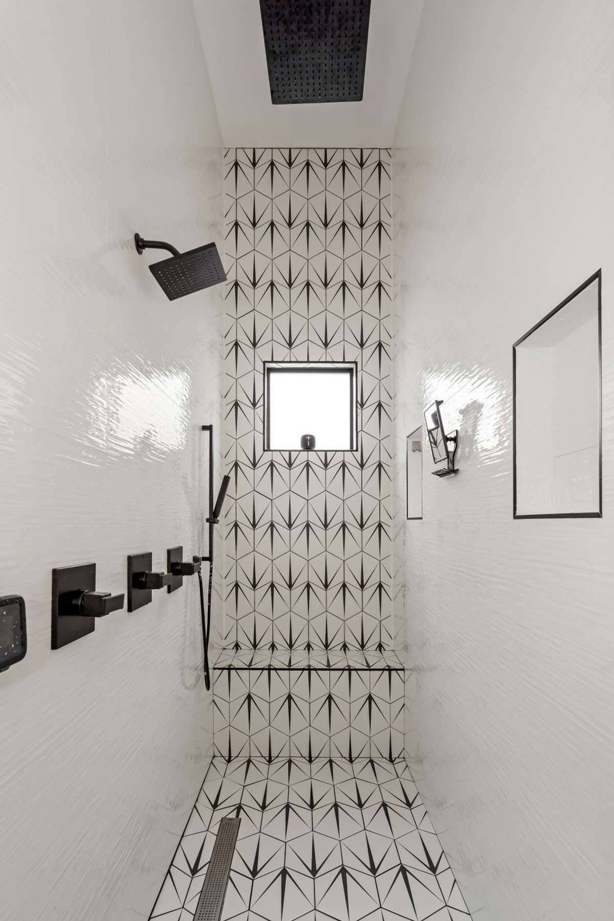 Resort-style walk-in tiled shower with dual shower heads + shower wand