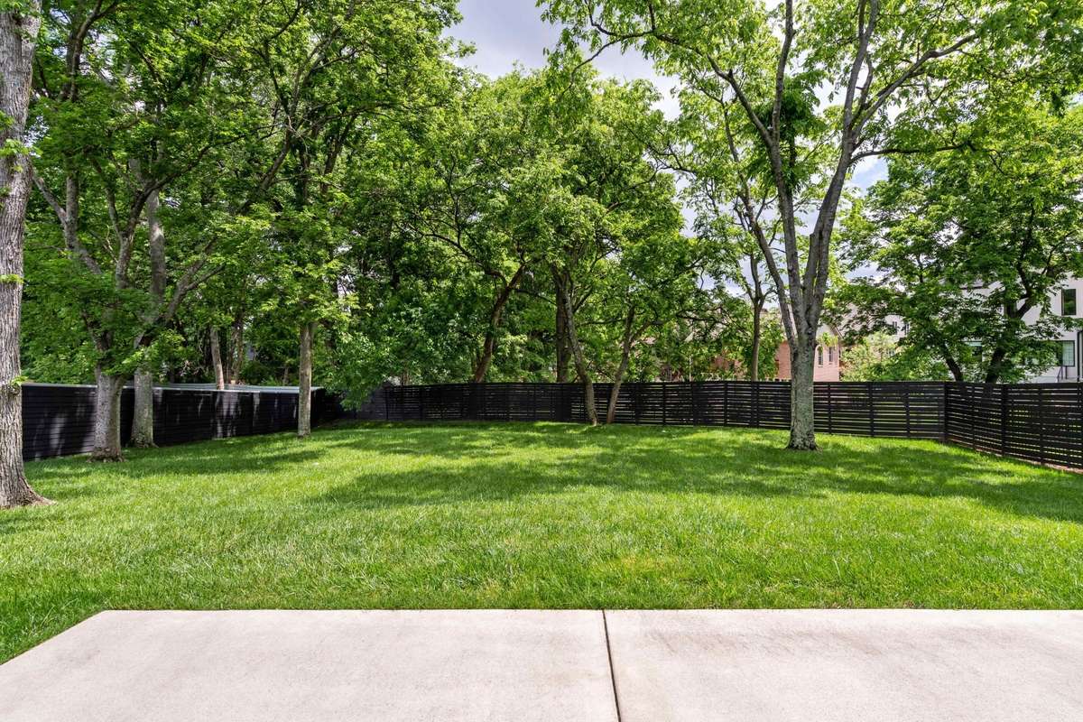The tree-lined yard provides lots of privacy and plenty of room to add a pool