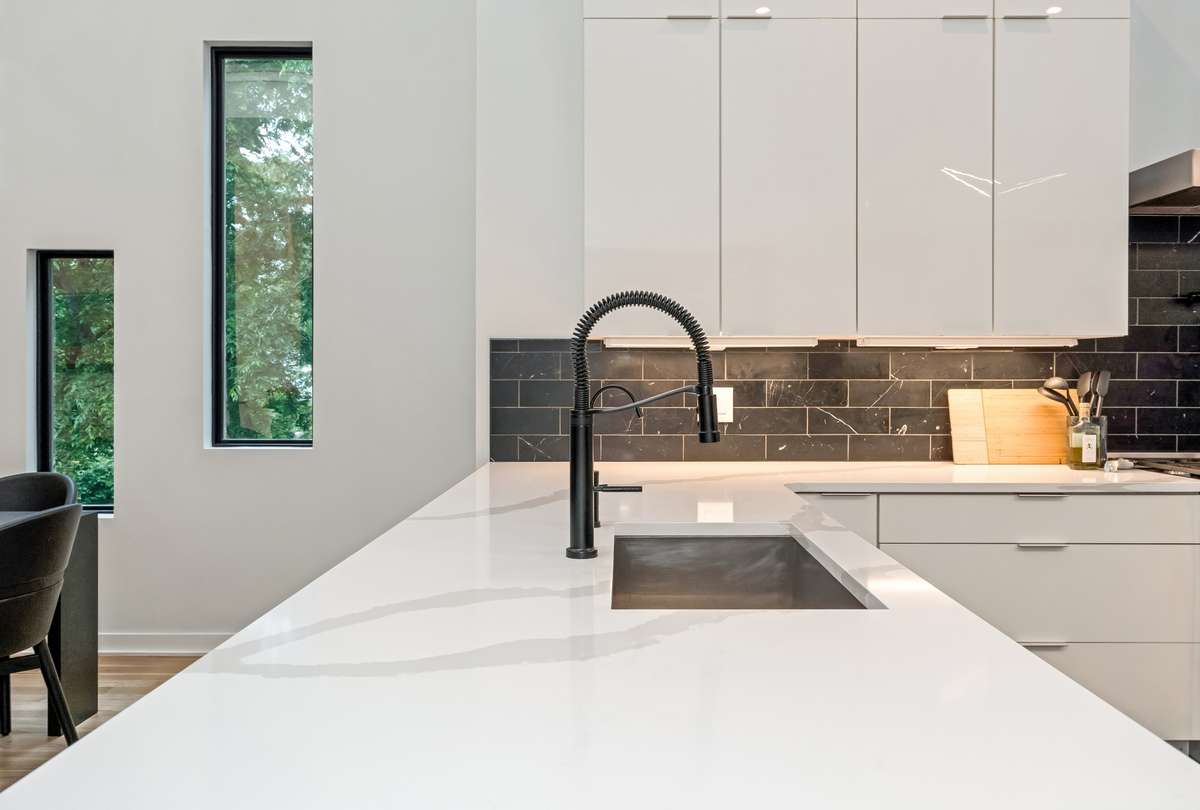 The subway tile backsplash offers a modern touch accenting the culinary space