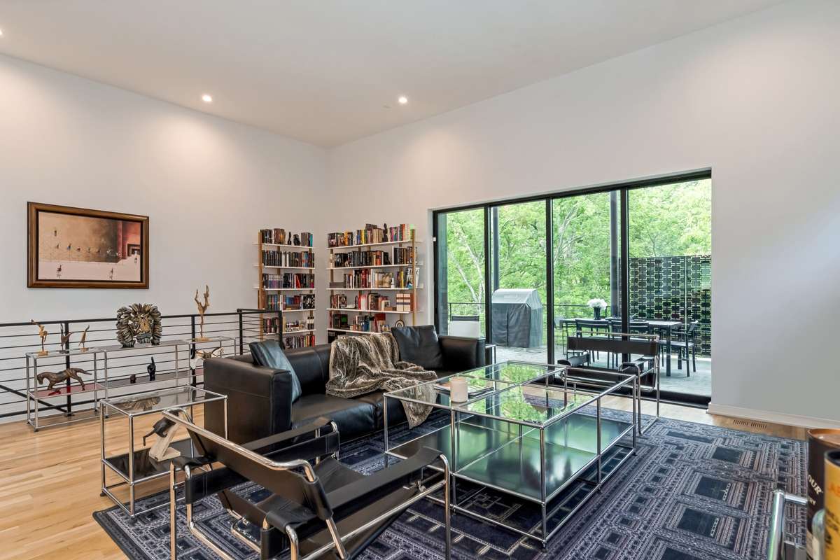 The large communal space offers incredible flexibility, with ample room for a library, music room, or additional seating to suit your lifestyle.
