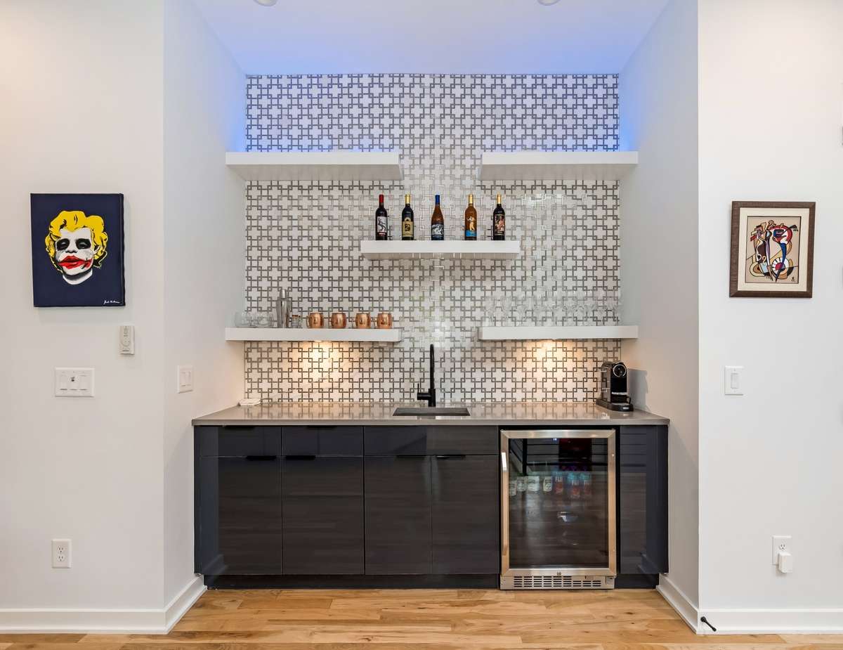 Comes complete with a wet bar, beverage fridge, and sink—everything you need for movie nights or game-day gatherings