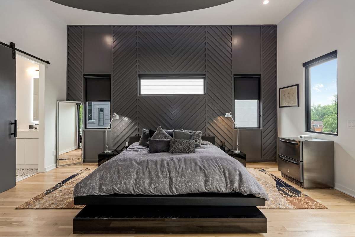 Black-out shades and a ceiling fan light add the perfect finishing touches to the space.
