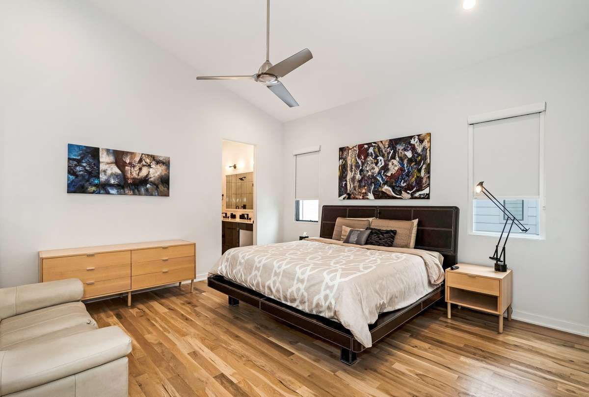 Three spacious en-suite bedrooms upstairs all with vaulted ceilings, walk-in closets, and a ceiling fan.  Your guests will never want to leave!