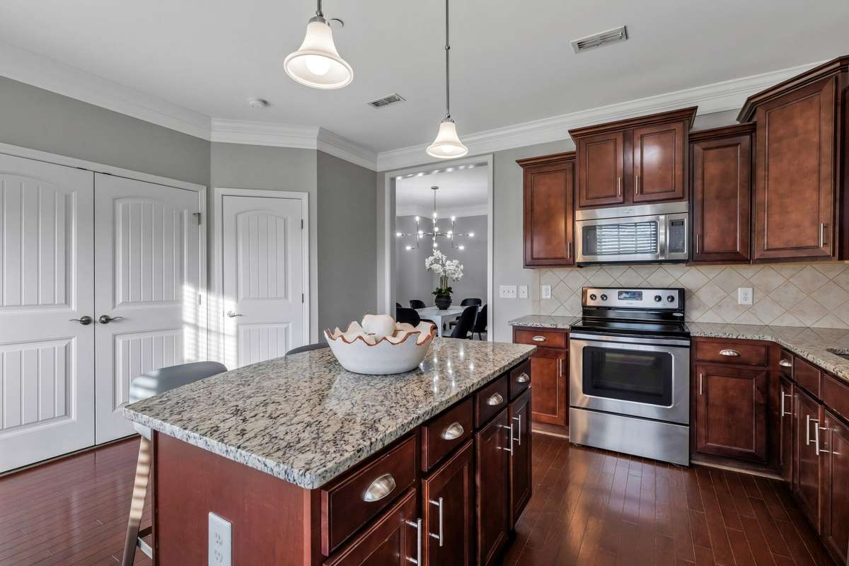 Double Doors lead to Laundry Space, adjacent is a half bath.