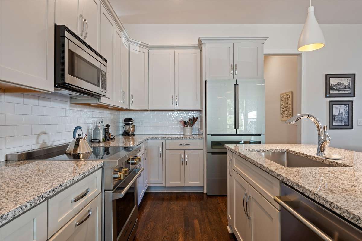 Upgraded appliances as of 2024 include, a Bosh refrigerator with a built in wine drawer, Fisher and Paykel double drawer dishwasher, Fisher and Paykel induction range, and Fisher and Paykel microwave that vents to the outside.