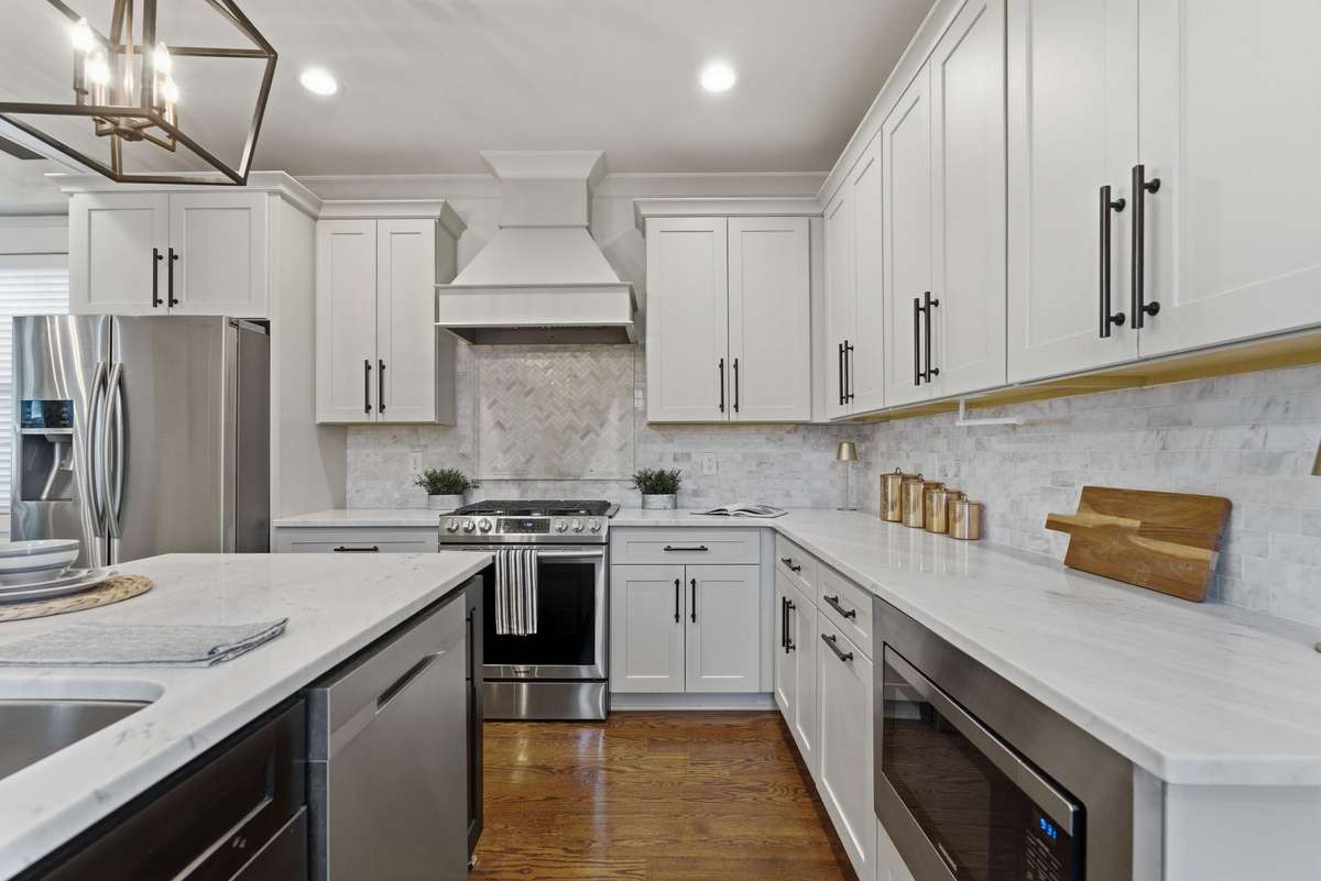 Gourmet kitchen with quartz countertops.