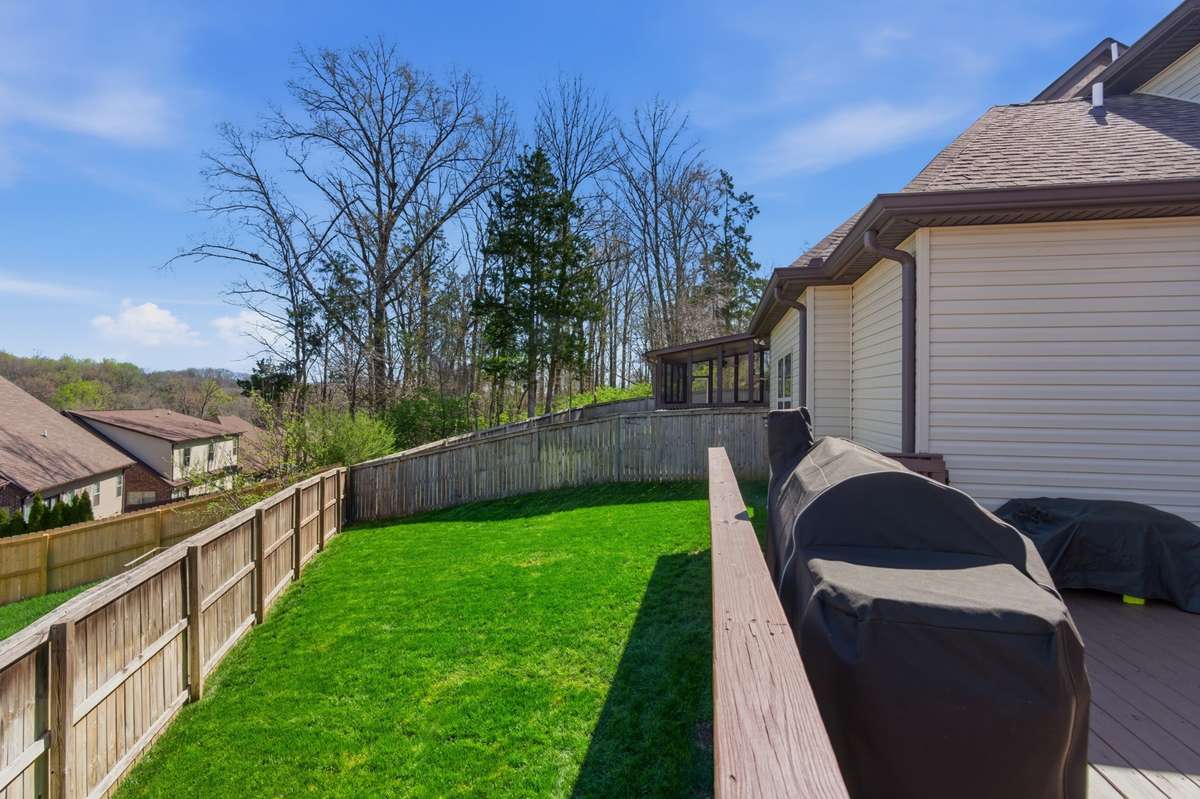 The yard has underground sprinklers tied to a hose bib on a timer to keep the yard looking lush and green.