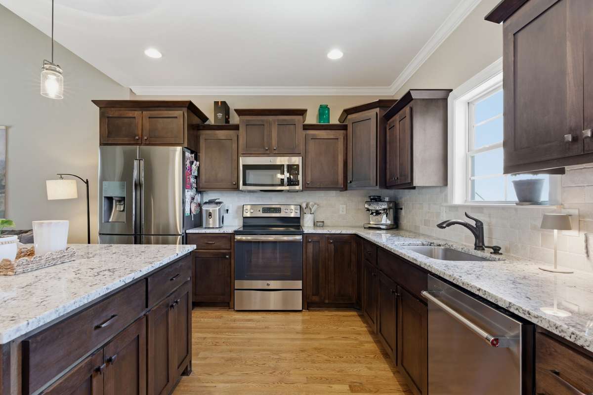 The window over the sink lets in such wonderful natural light! The dishwasher was just upgraded/replaced this past year.