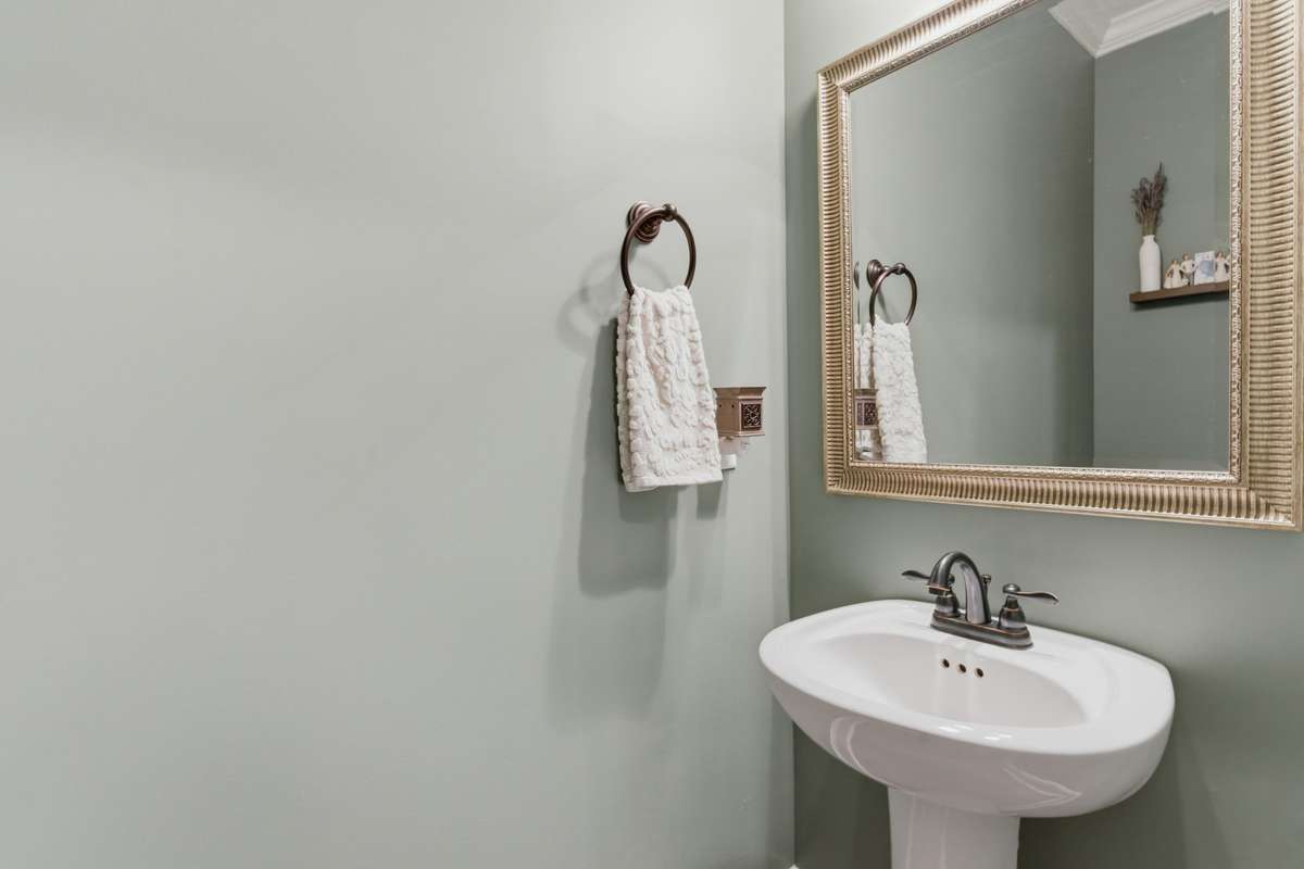 There is a hallway powder bath on the main floor hallway for guests.
