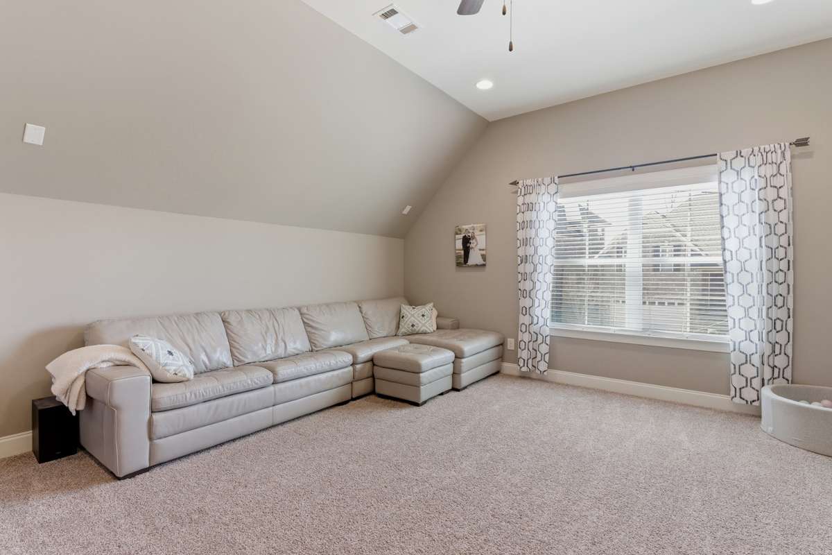 The large bonus room has a great double window and recessed lighting.