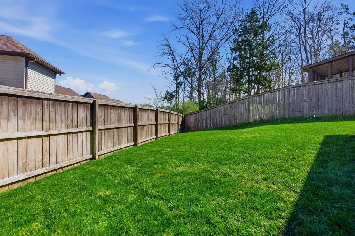 There is a wooded area to the right side of the property which gives a nice privacy element to the outdoor area.