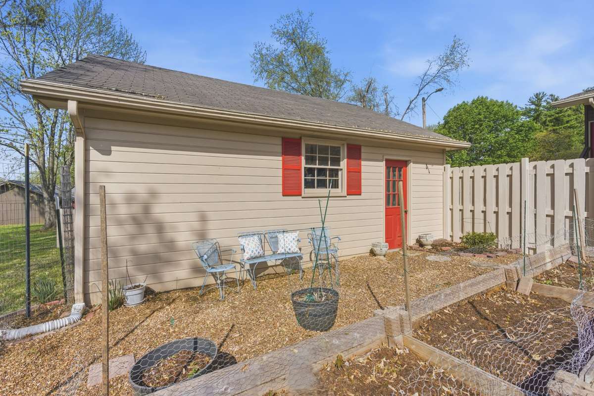 Fenced in garden.  Planter boxes remain.