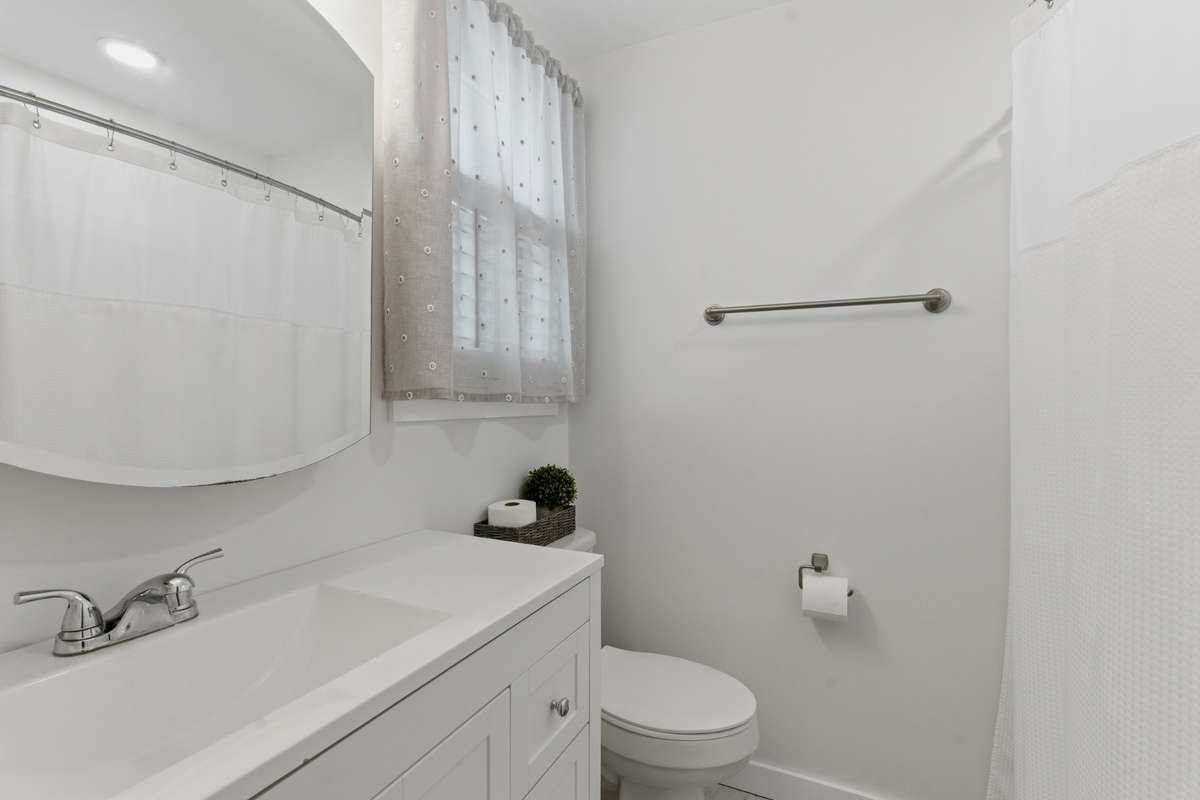 Updated primary bathroom with walk in shower.