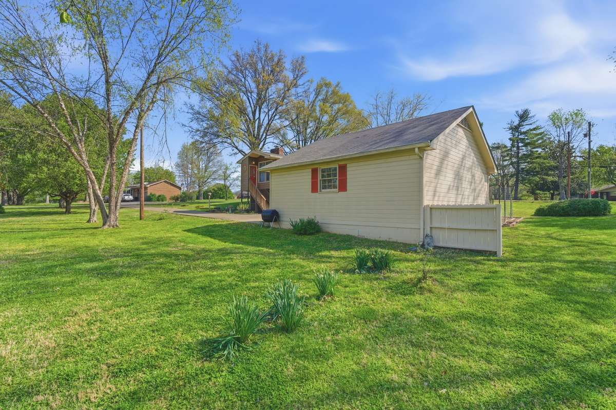 Detached two car garage with storage area above.
