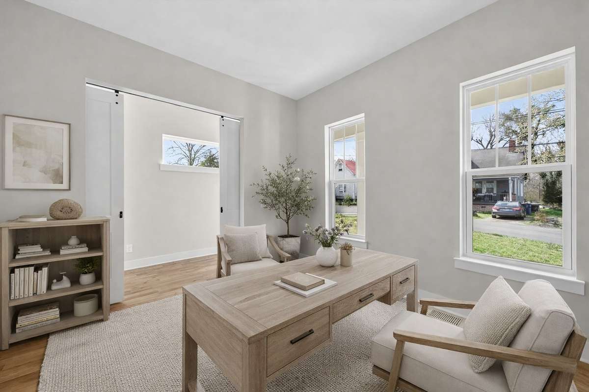 This photo has been virtually enhanced to show you a possibility - This is an bedroom or potential office on the main floor.