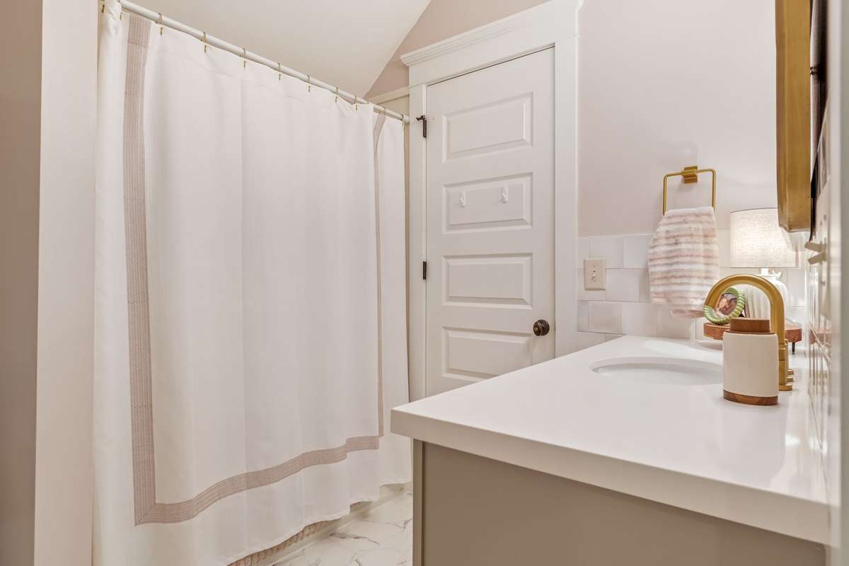 The upstairs bathroom is shared by both bedrooms...