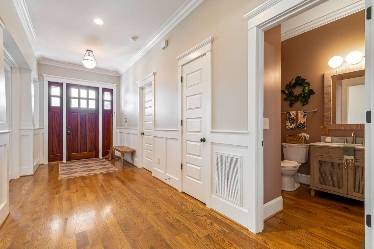 To your left is the first guest suite on the main floor, plus powder room....photos of guest suite will be coming soon...