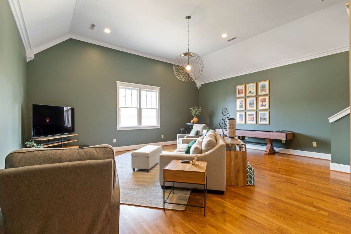 Step into this beautiful main floor bonus area with new hardwood flooring...