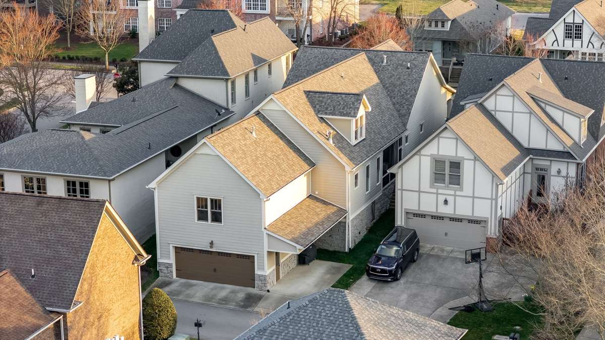 These homes are entered thru the rear alley entrance. This home hosts a 2 car garage with an EV Charger as well as an additional covered parking pad...