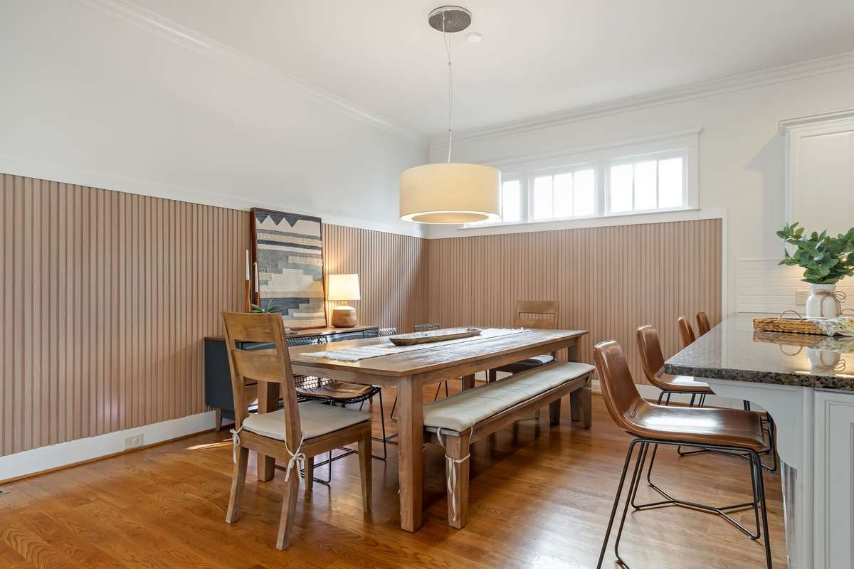 The fresh and updated look that the Sellers achieved with the slat wood panelled walls is amazing...