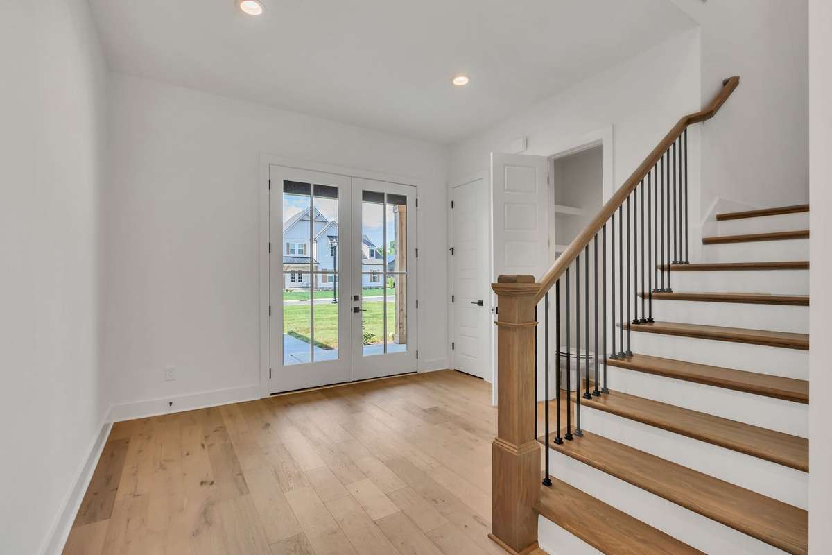 Photo of a previous built Ensley home. Shown for illustration purposes only. Materials and finishes will vary. View of the foyer area at the front door. Color scheme will be similar.