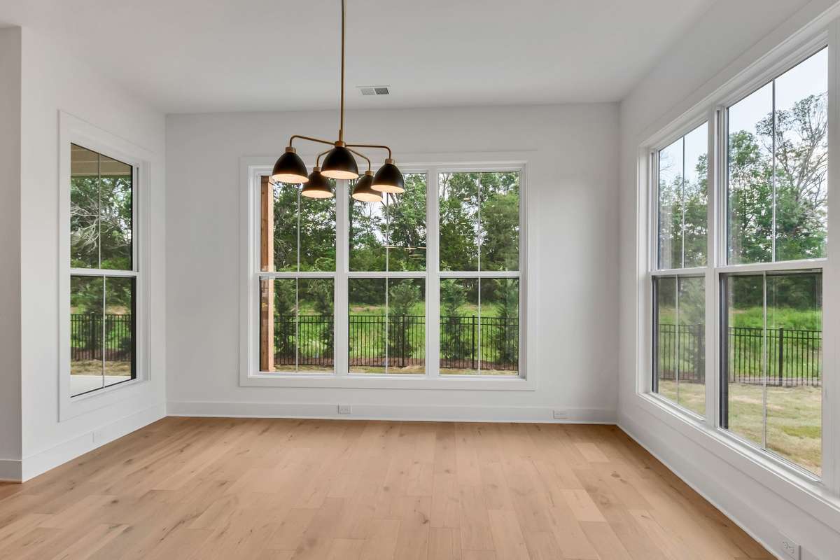 Photo of a previous built Ensley home. Shown for illustration purposes only. Materials and finishes will vary. Ask listing agent for included features on this home. Breakfast room off kitchen.