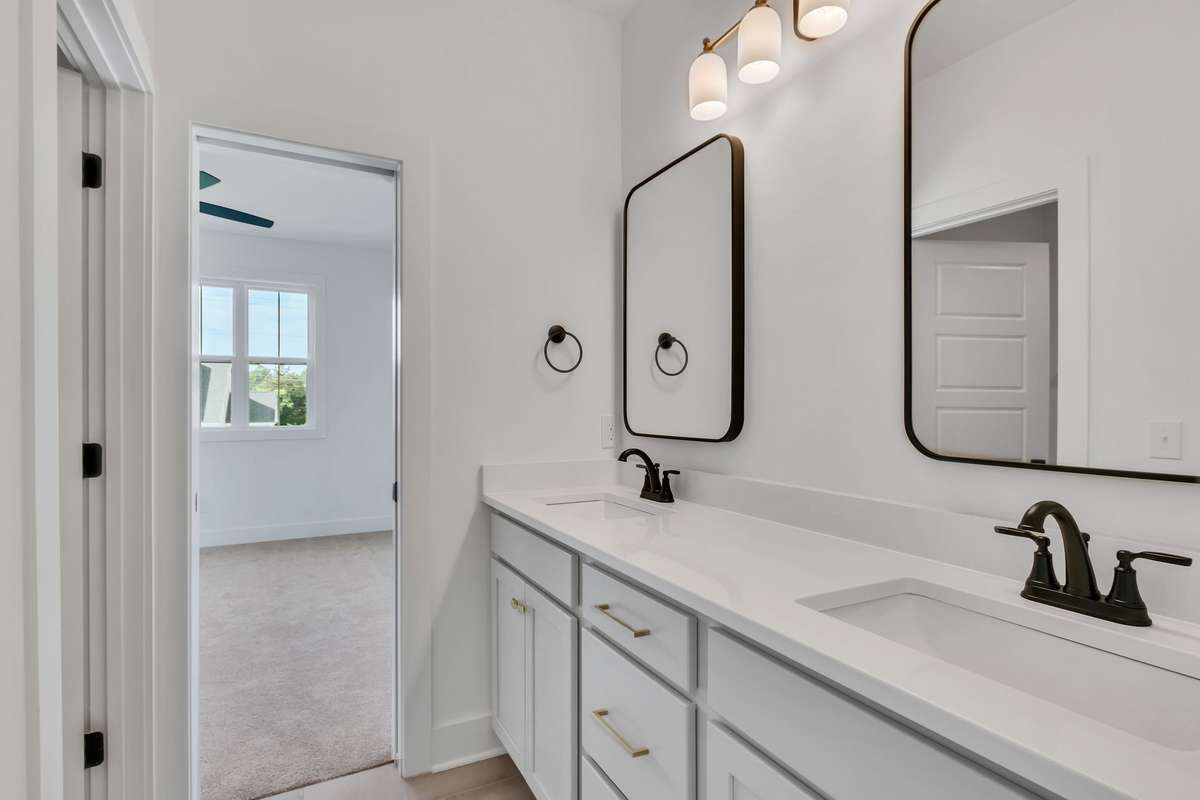 Photo of a previous built Ensley home. Shown for illustration purposes only. Materials and finishes will vary. Ask listing agent for included features on this home. Mirrors will be different on lot 47 Brewer Point.