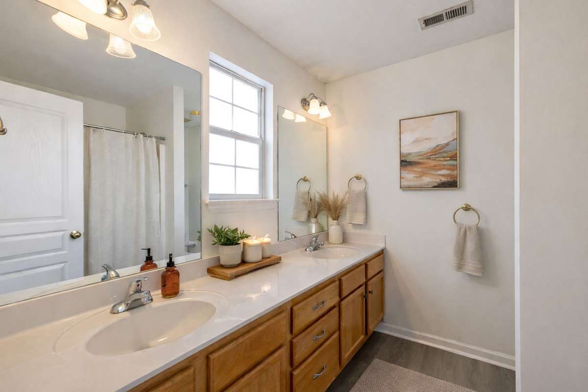 Primary bathroom includes extra-large countertops, lots of natural light, shower/soaking tub combo.