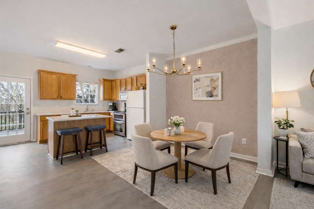 Charming dining space that opens to the living room and kitchen. (Virtually staged.)
