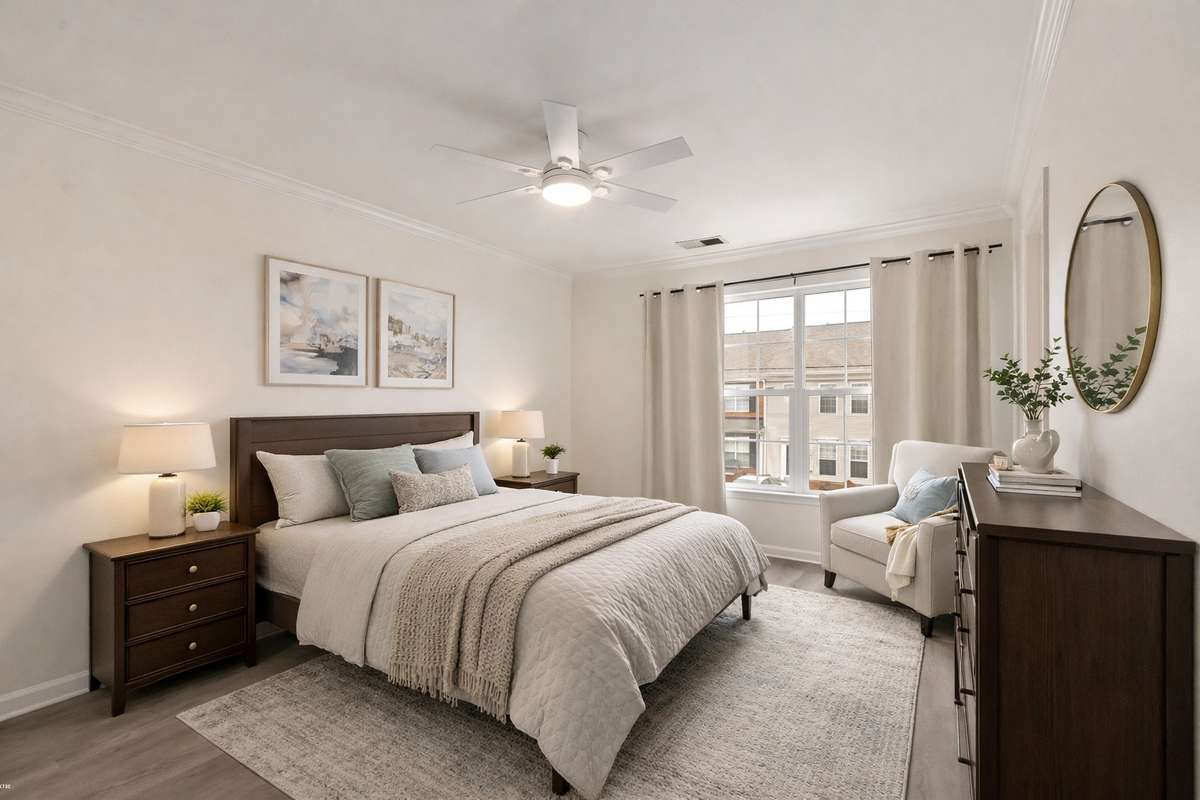 Primary bedroom is extra spacious and includes a walk-in closet, lots of natural light, and a primary bathroom suite. (Virtually staged.)