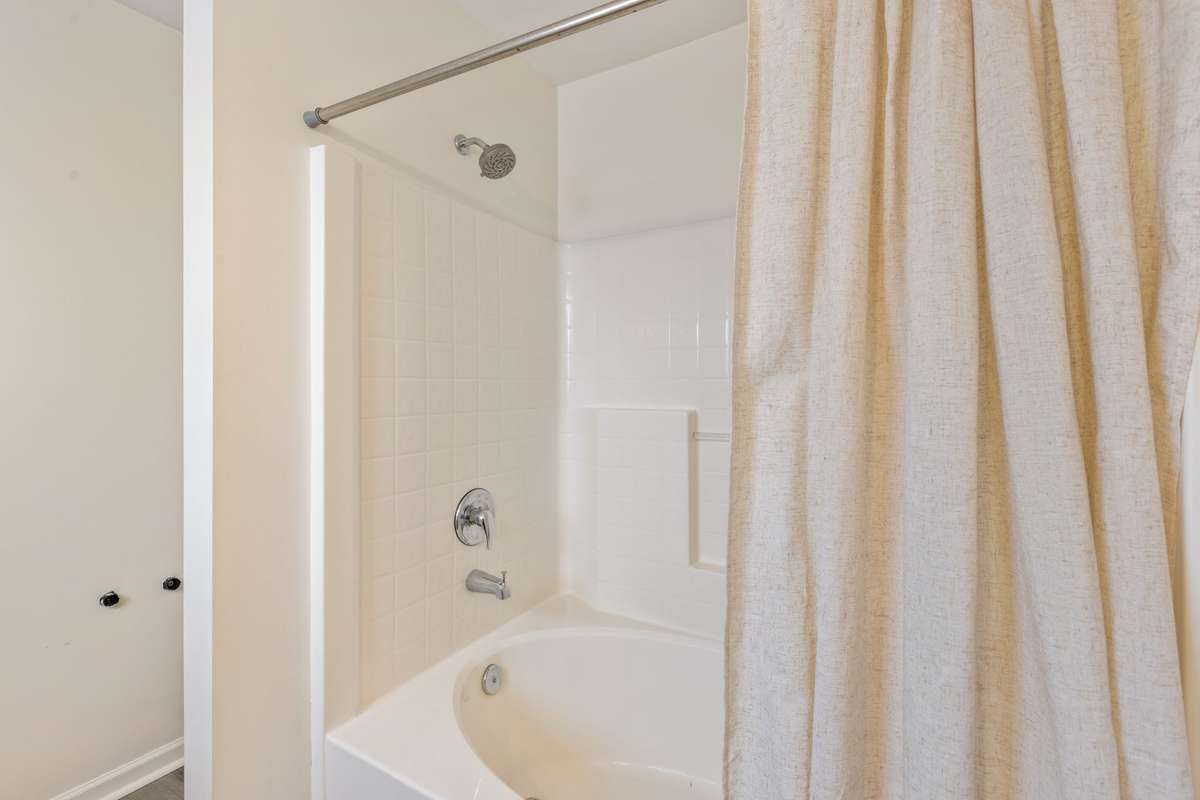 Primary bathroom shower/soaking tub combo.