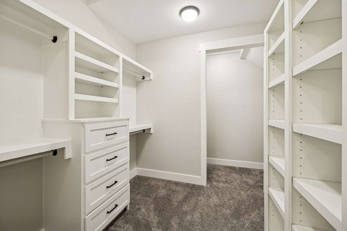 Primary custom California closet with beautifully crafted storage. 763 Thompson Creek Rd. Shelbyville, TN 37160