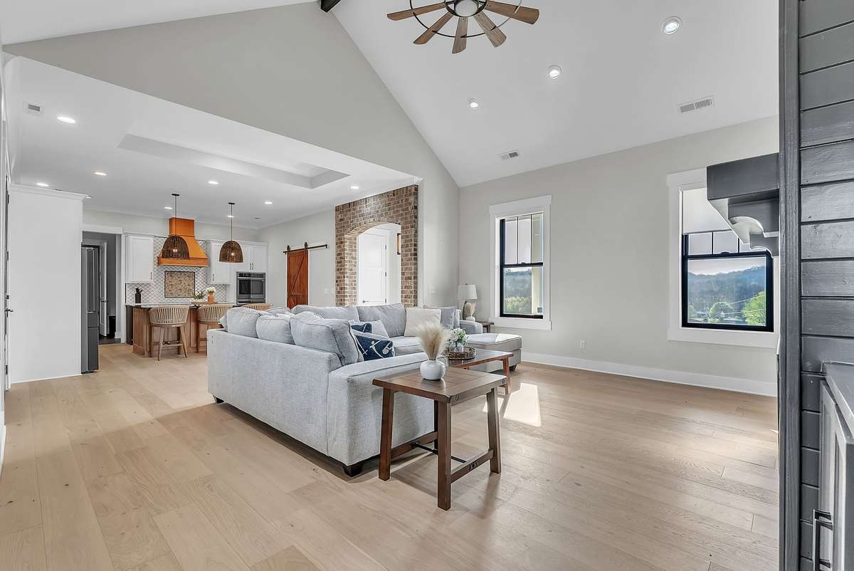 Step into your living room with hardwood floors, vaulted ceiling with modern fan, & built in shelving. 763 Thompson Creek Rd. Shelbyville, TN 37160