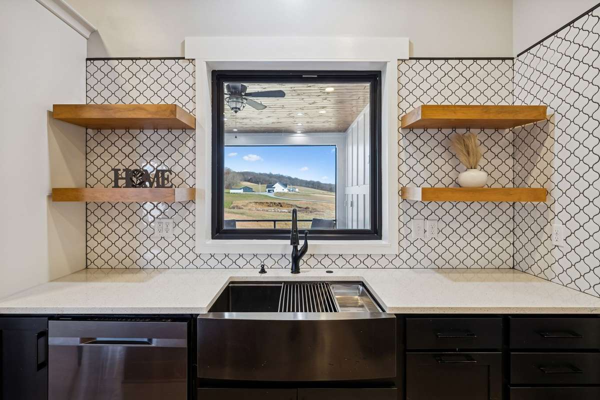 In addition to ample cabinet storage, enjoy these build in shelves & an over sink window with a view. 763 Thompson Creek Rd. Shelbyville, TN 37160