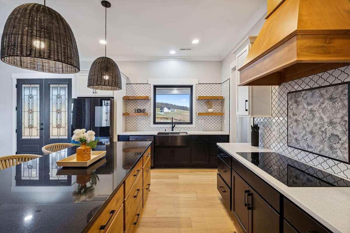 Your kitchen has a built in cook top, tile backsplash & hardwood floors. 763 Thompson Creek Rd. Shelbyville, TN 37160