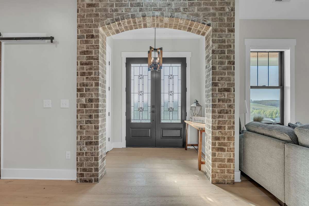 Your beautiful front entry features modern lighting & stunning brickwork. 763 Thompson Creek Rd. Shelbyville, TN 37160