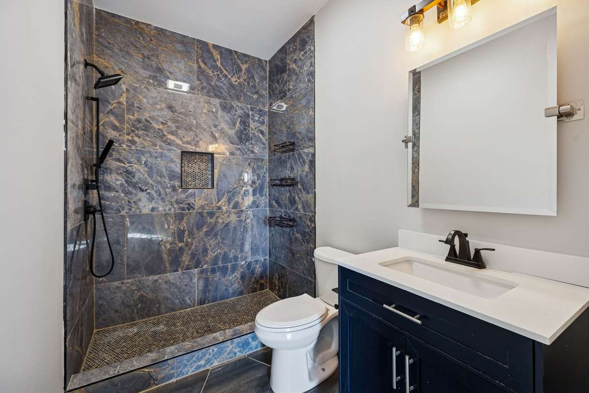 Check out this stunning guest bath with single vanity & tiled walk in shower. 763 Thompson Creek Rd. Shelbyville, TN 37160