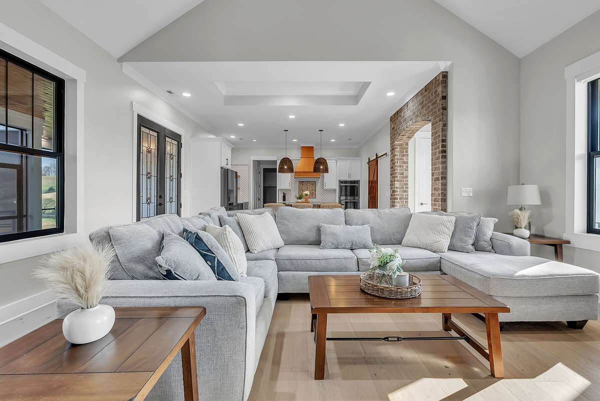 Another view of your open concept living room featuring recessed lights, & several windows providing nice natural lighting. 763 Thompson Creek Rd. Shelbyville, TN 37160