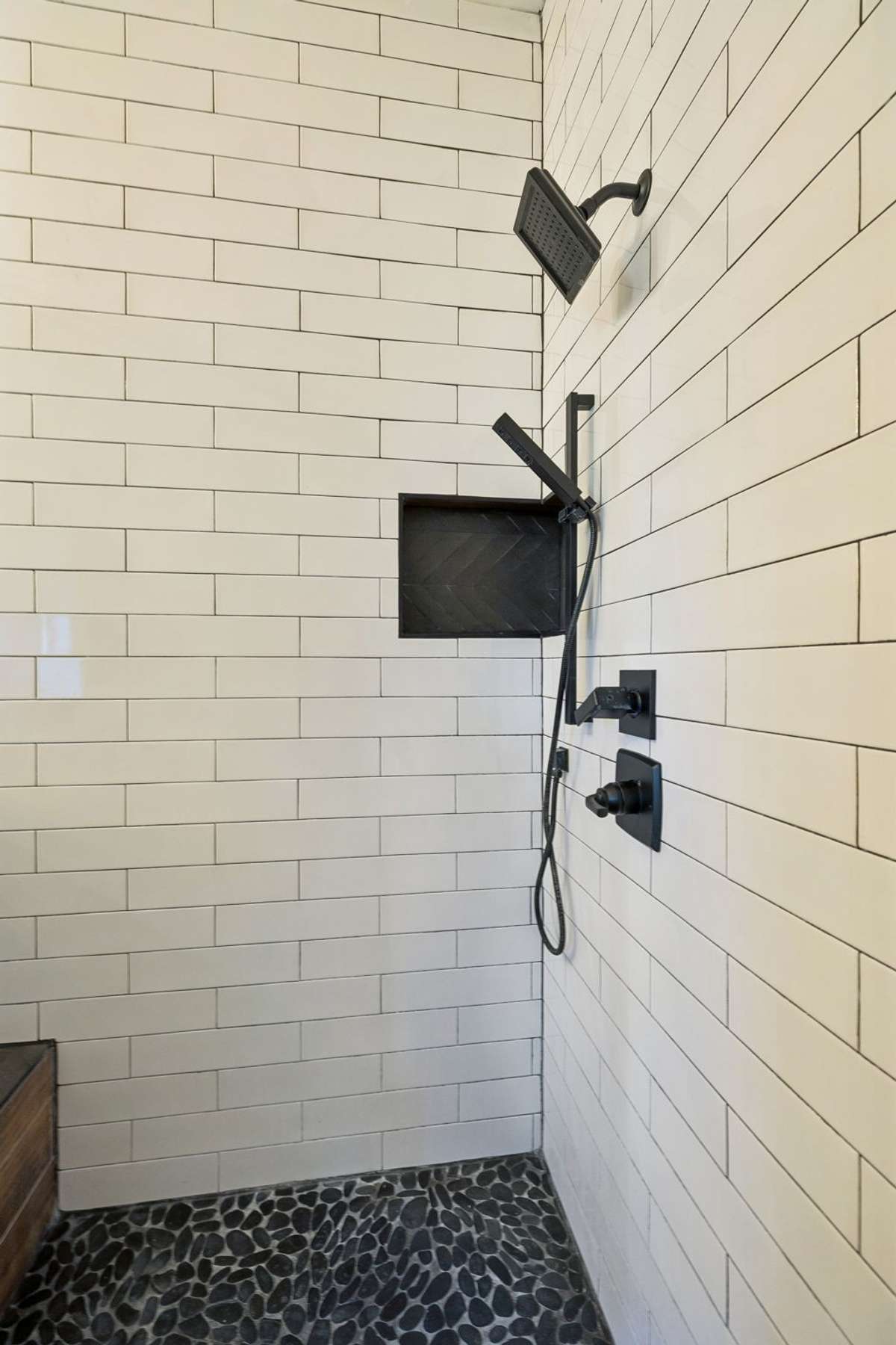 Your walk in shower features a stone floor & subway tile. 763 Thompson Creek Rd. Shelbyville, TN 37160